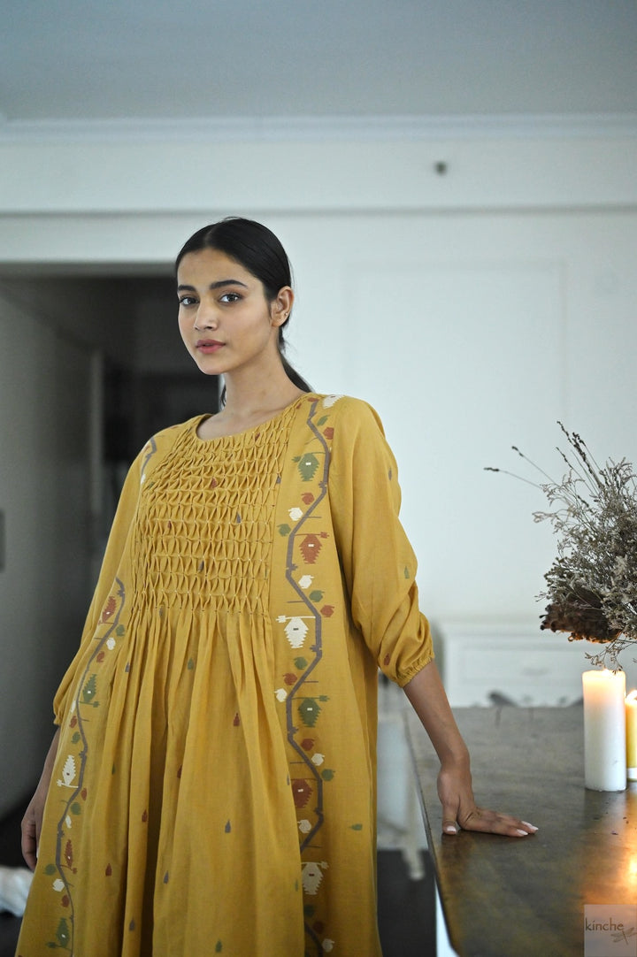 Hand smocked Jamdani dress in Ochre